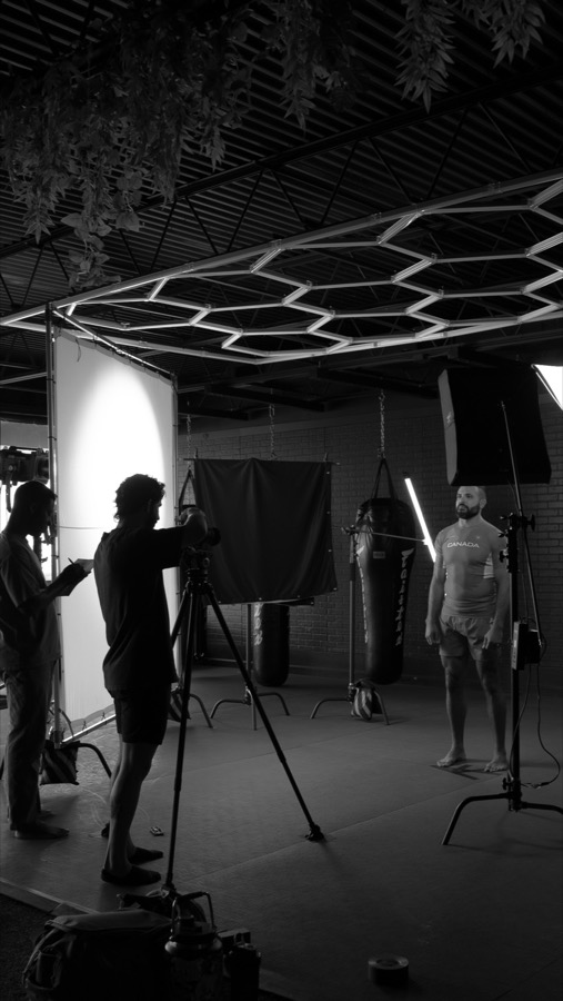 The crew reviewing a take on set.